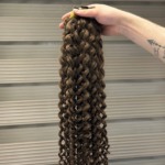 A bundle of Genuine Raw Hair in shades of brown and light brown